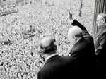 Winston Churchill waves to crowds following the allied victory in World War Two